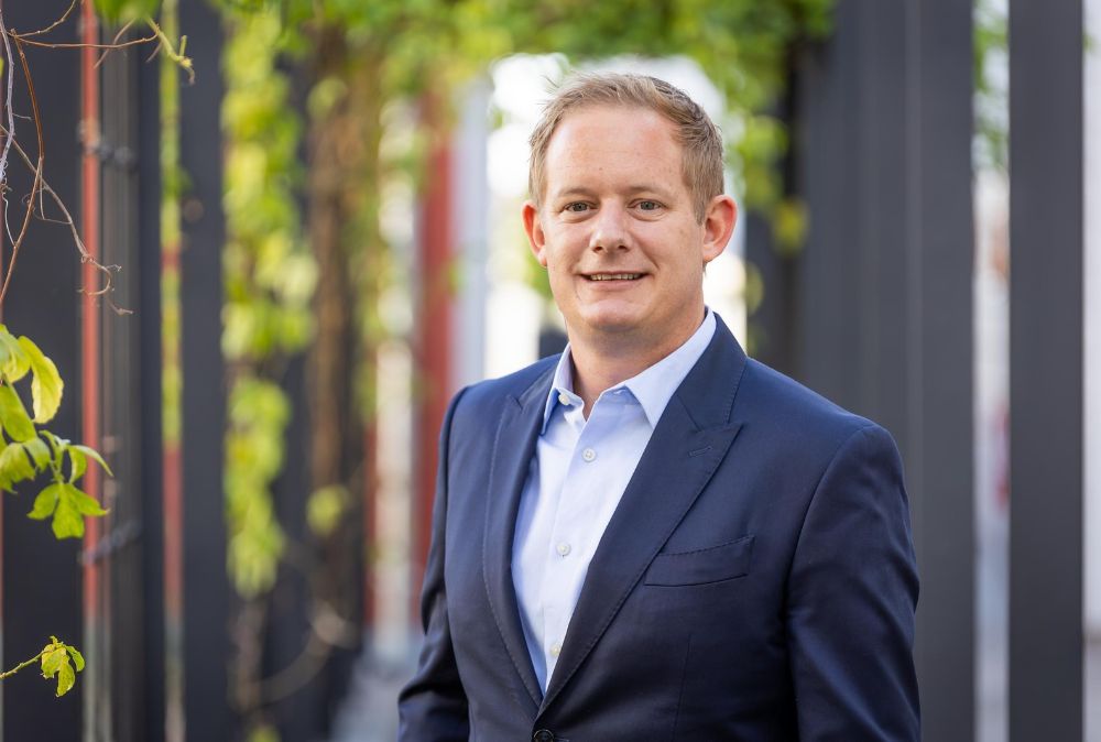 Image shows the Managing Director of Bank Windhoek, Mr James Chapman, dressed in a blue suit.